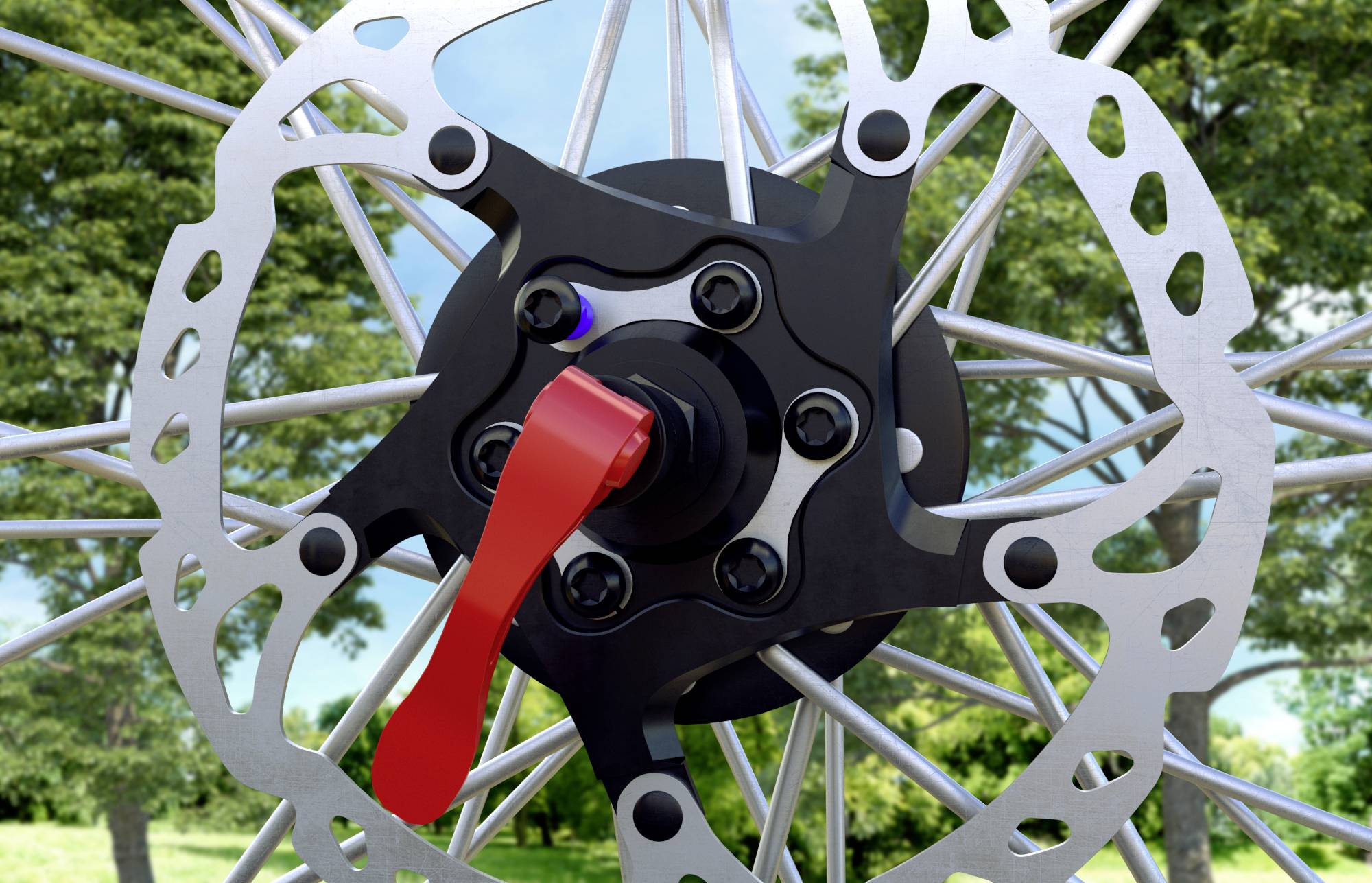 Nahaufnahme einer Fahrradscheibenbremse mit roter Schnellspannhebel, umgeben von einem metallenen Speichenrad; im Hintergrund Bäume.