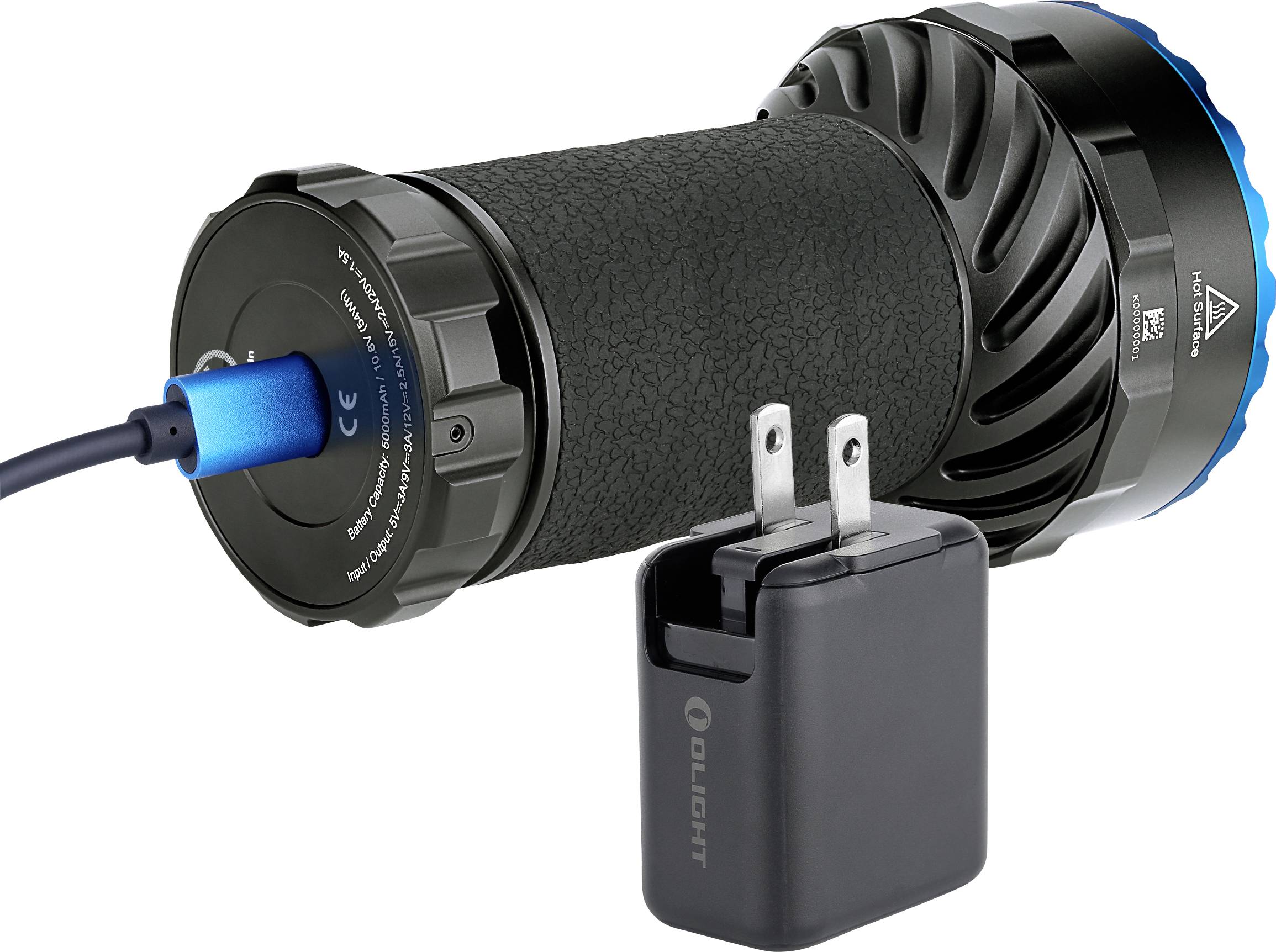 Taschenlampe mit strukturierter Oberfläche, wird über USB-Kabel aufgeladen. Neben dem Gerät liegt ein schwarzes Ladegerät.