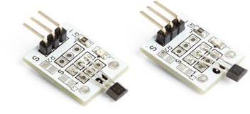 Zwei weiße elektronische Sensoren mit je drei Metallpins, montiert auf einer kleinen Platine, nebeneinander liegend.