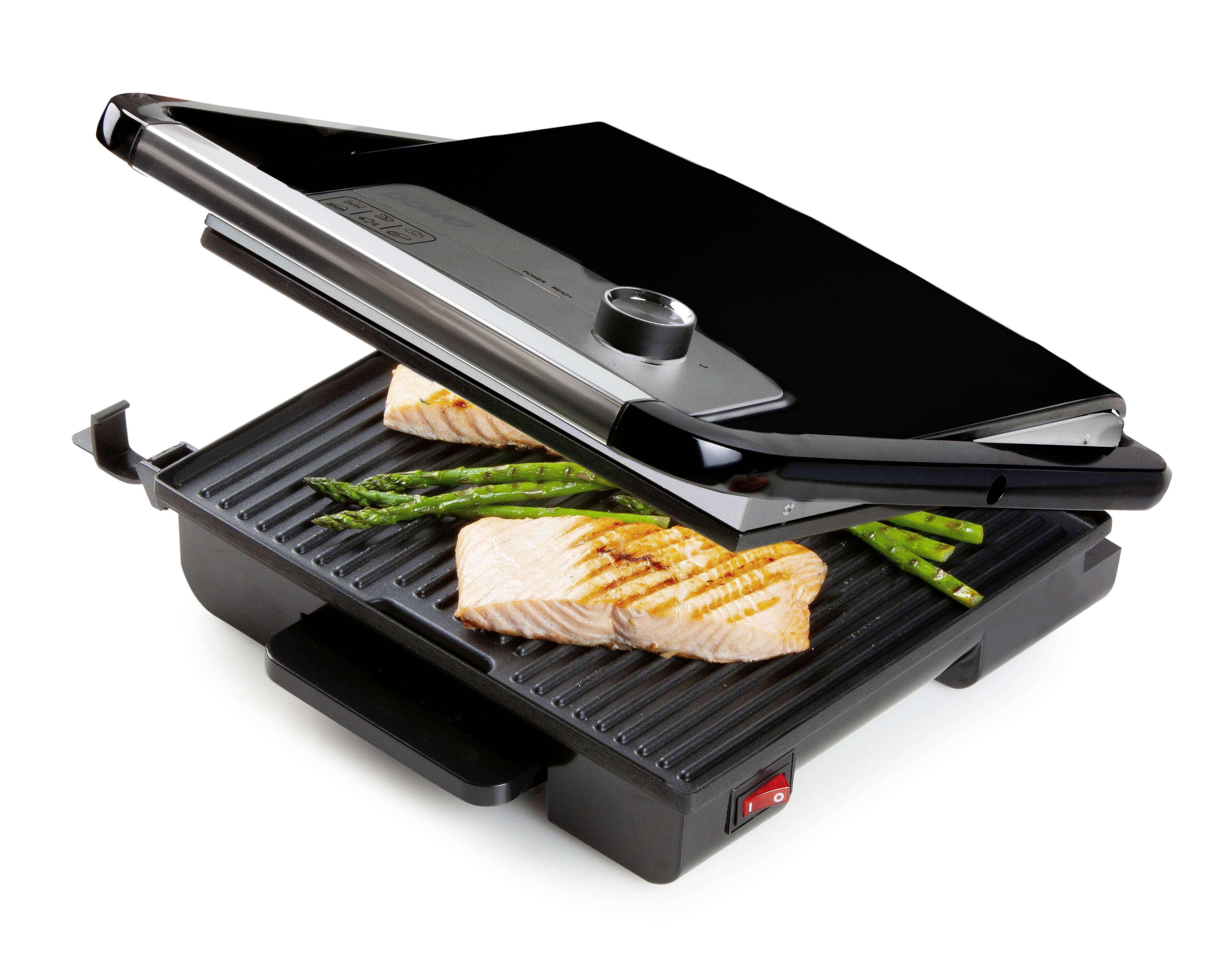 Ein Kontaktgrill mit geöffnetem Deckel grillt zwei Lachsfilets und Spargelstangen.