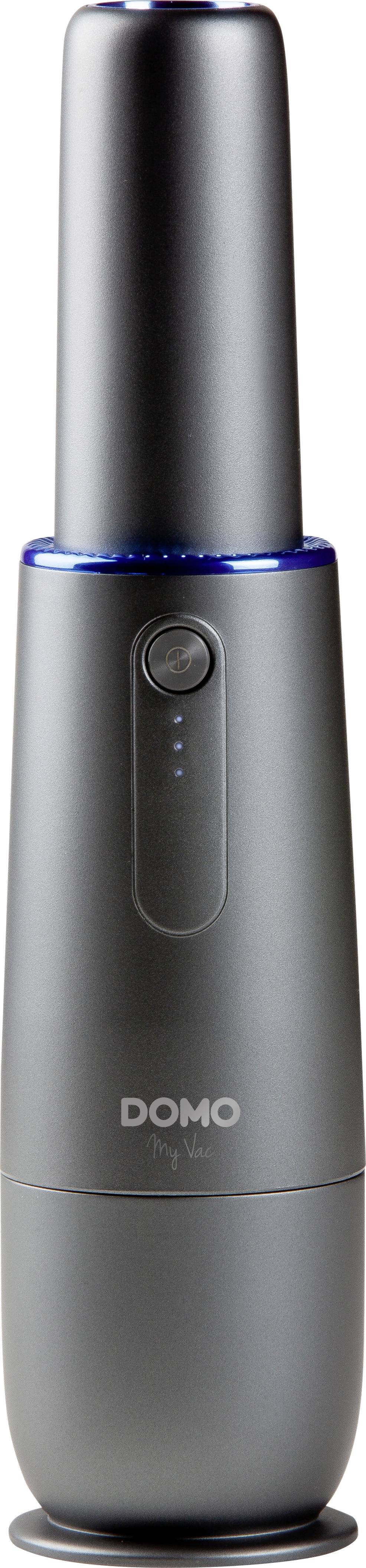 Kompakter, grauer, zylinderförmiger Handstaubsauger mit LED-Anzeige und Logo 'DOMO'. Ideal für kleine Reinigungsarbeiten.