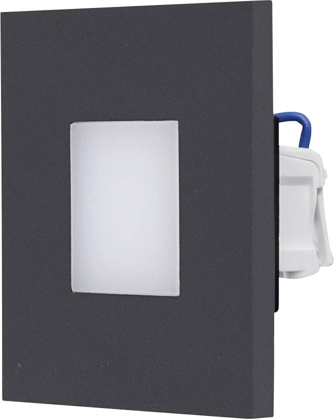 Schwarze rechteckige Wandabdeckung mit einer zentriert angebrachten weißen Schalterplatte und einem teilweise sichtbaren blau-weißen Elektrogerät dahinter.