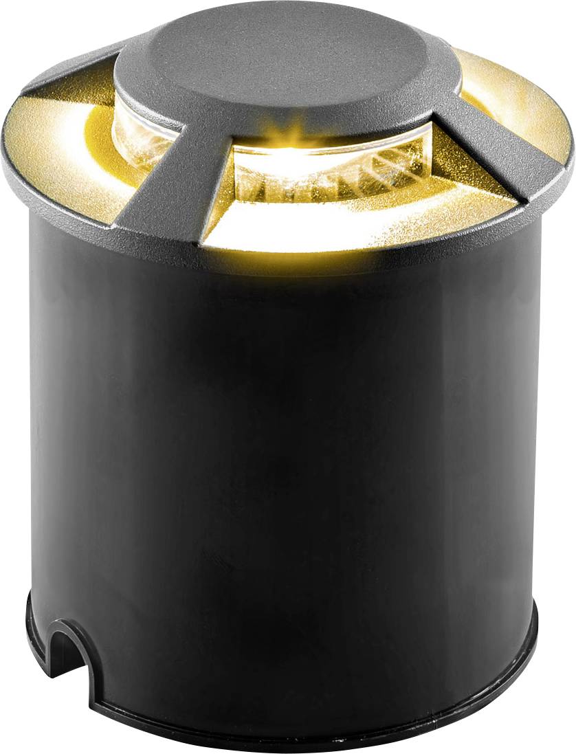 Eine schwarze Bodenleuchte mit runder Form und warmem Licht, das gleichmäßig durch mehrere Schlitze auf der Oberseite scheint.