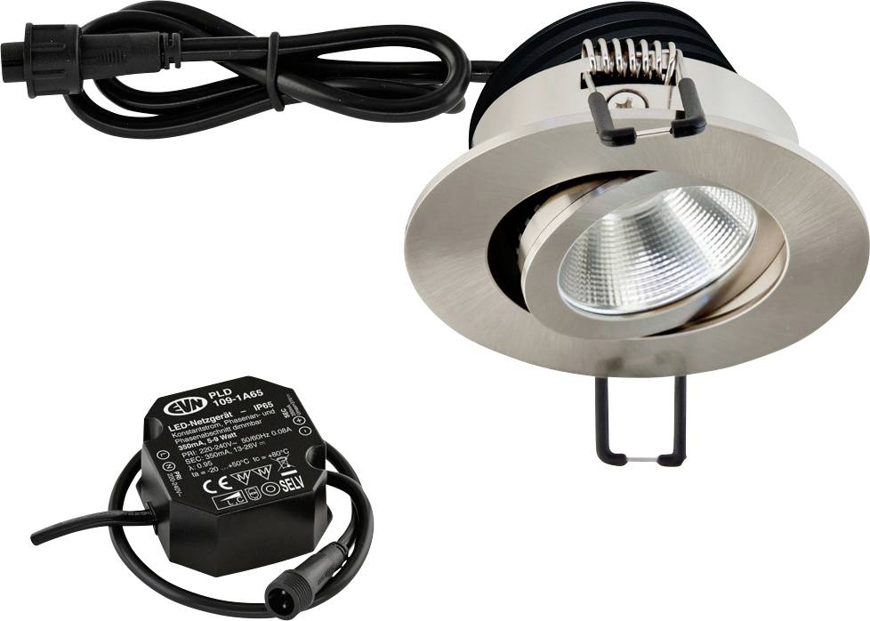 Ein runder LED-Spotlight mit Metallrand und Kabel, daneben ein schwarzes Netzteil mit technischen Spezifikationen.