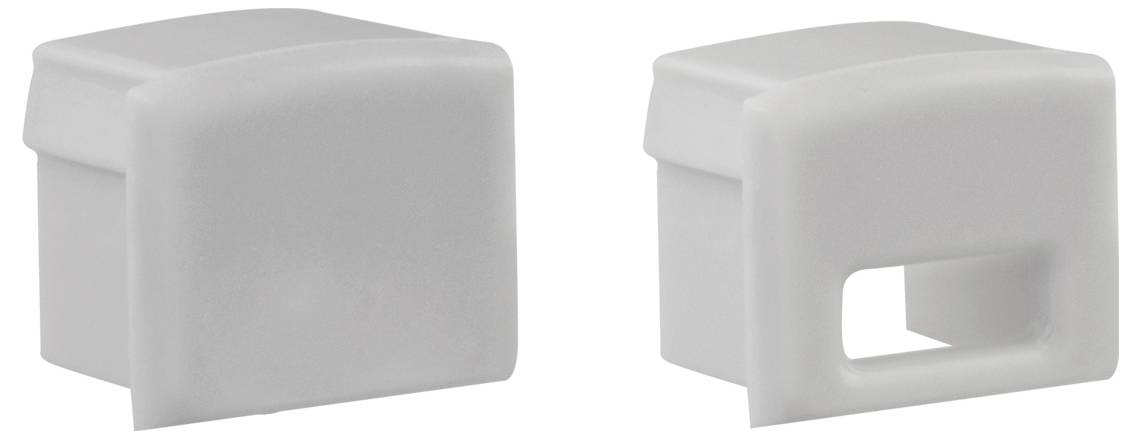 Zwei Ansichten einer weißen Kunststoffkappe oder eines Abdeckungsblocks in rechteckiger Form, eine massiv und eine mit einer rechteckigen Ausschnittöffnung.