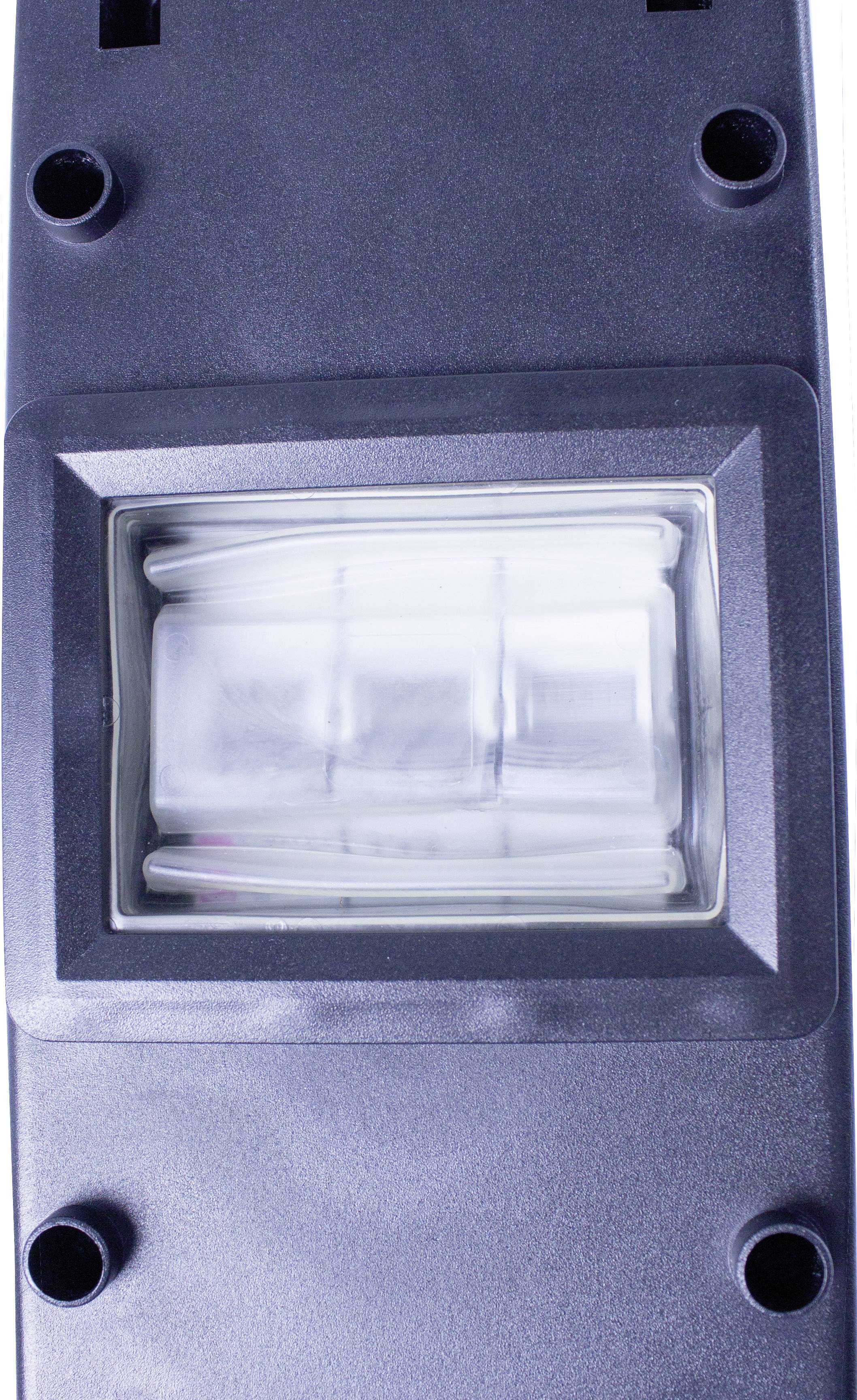 Ein schwarzes Gerät mit einem rechteckigen, durchsichtigen Fenster, hinter dem eine weiße Lichtquelle sichtbar ist.