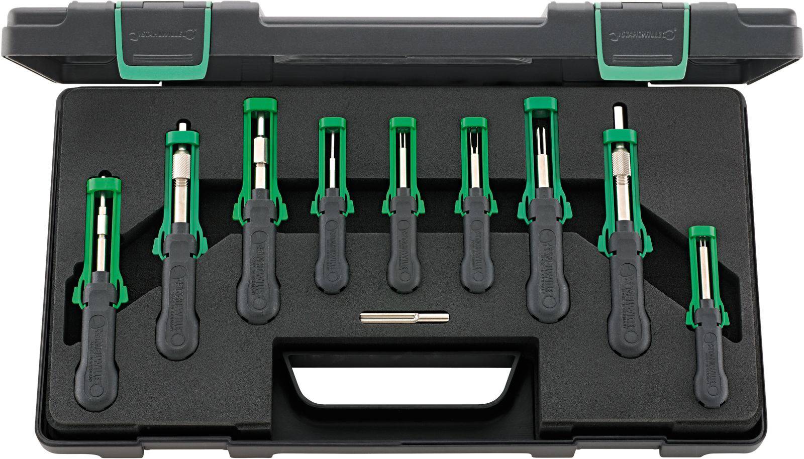 Satz von neun grünen Schraubenziehern in einem schwarzen Werkzeugkasten. Jeder hat einen schwarzen Griff und Metallkopf.