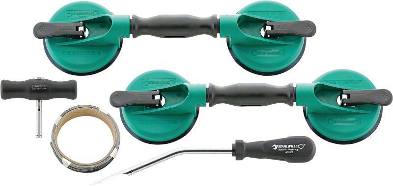 Werkzeugset mit zwei grünen Saughebern, schwarzem Schraubendreher, T-förmigem Griff und Metallband, zur Handhabung von Glasplatten.