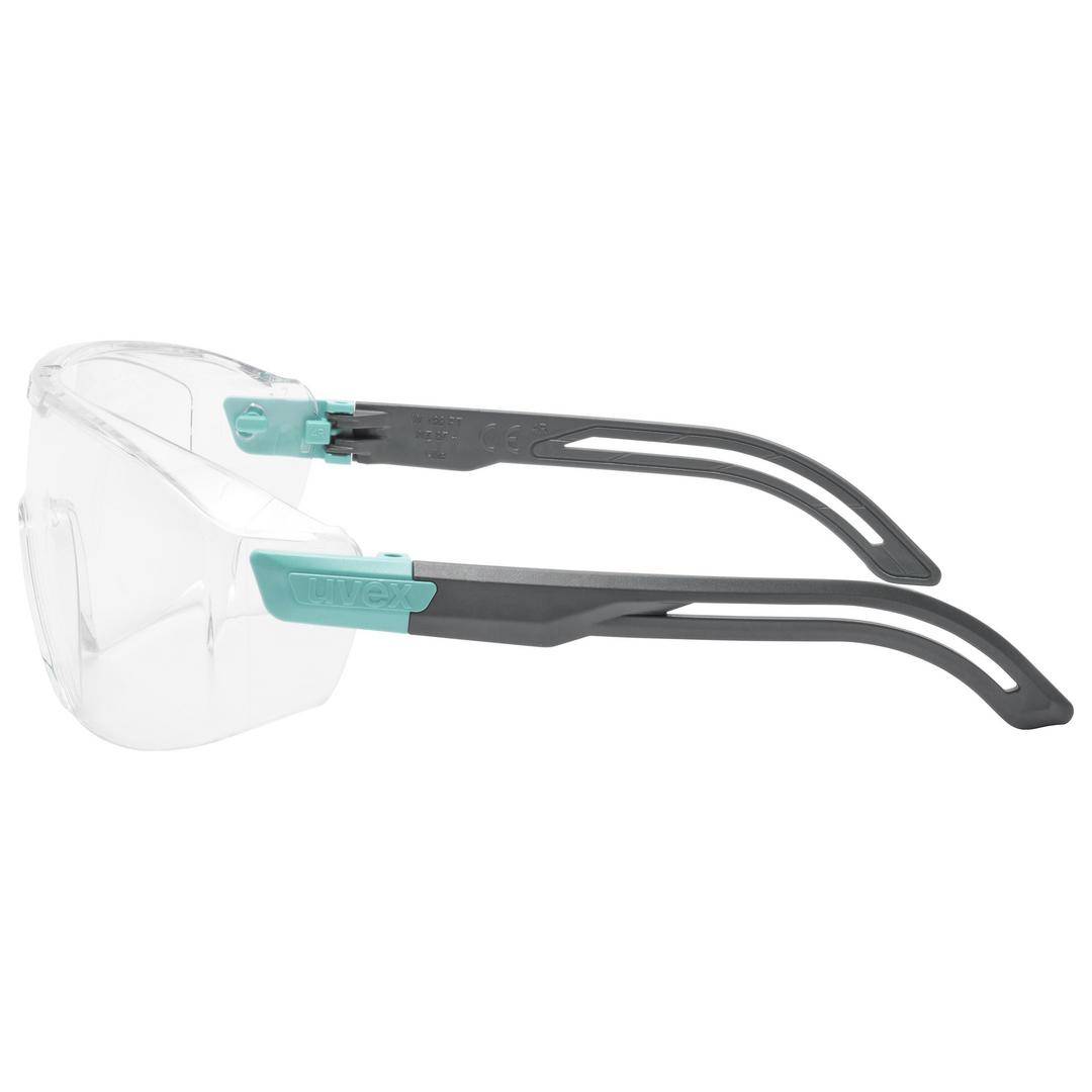 Schutzbrille mit transparenten Gläsern und grauen, gebogenen Bügeln. Entworfen für Augenschutz bei handwerklichen oder industriellen Tätigkeiten.
