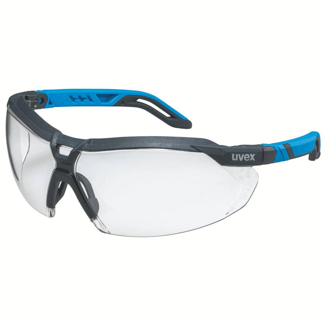 Eine Schutzbrille mit grauem Rahmen und blauen Bügelenden. Sie besitzt klare Gläser und bietet Augenschutz bei handwerklichen Arbeiten.