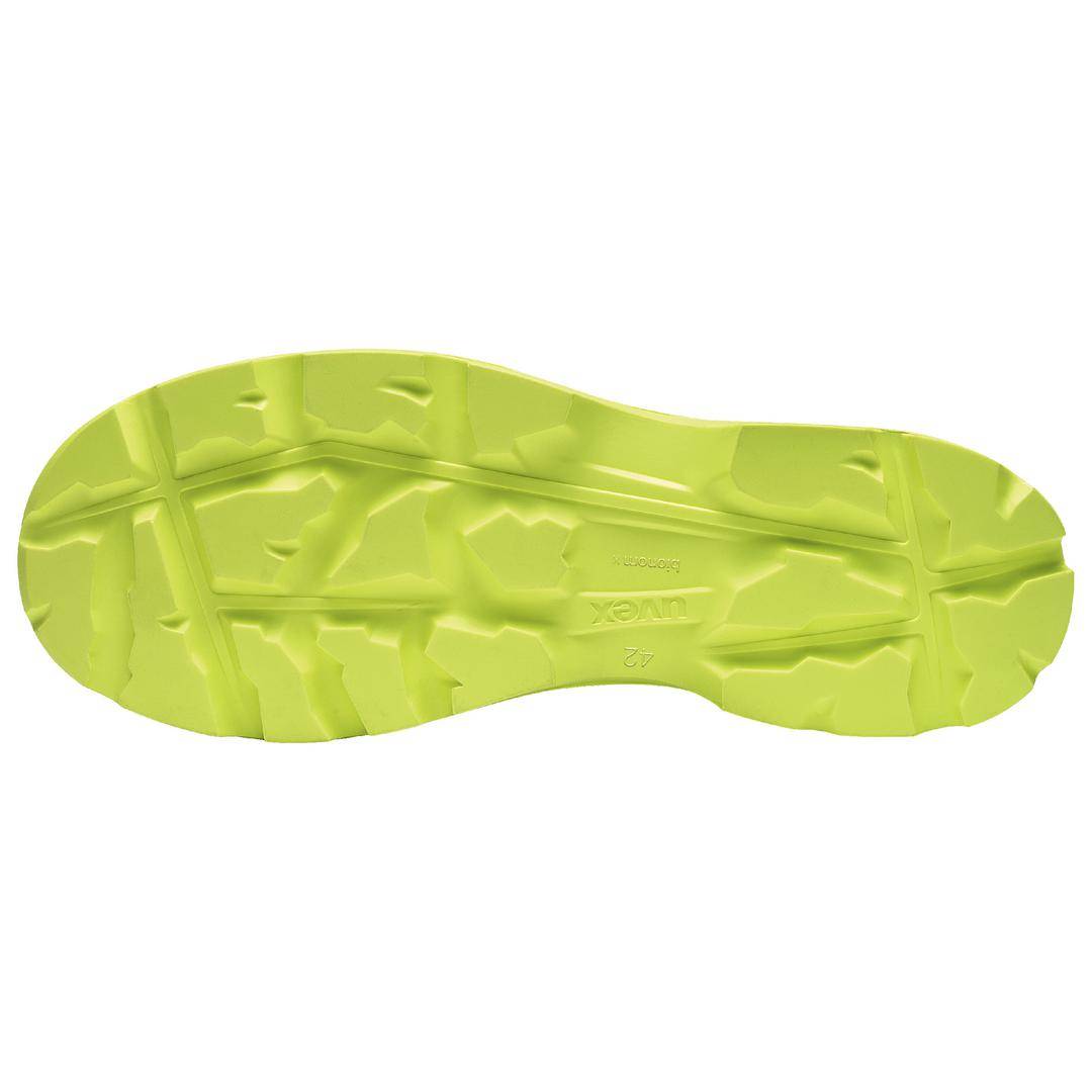 Gelbe Schuhsohle mit einem groben, gezackten Profil für Grip. Geeignet für Gelände oder rutschige Oberflächen.