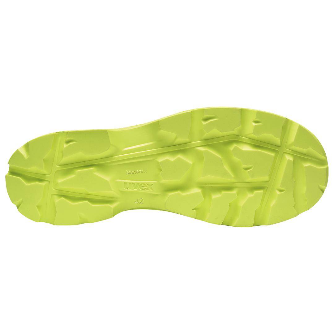 Die Abbildung zeigt die gelbe Unterseite einer profilierten Schuhsohle mit der Aufschrift 'WUXE', markiert mit der Schuhgröße 42.