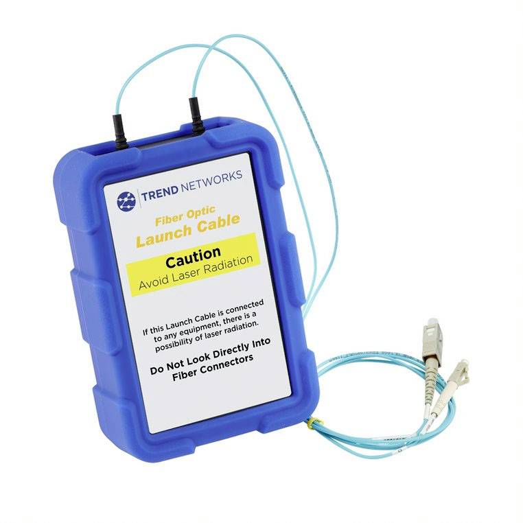 Blaues Gehäuse mit Glasfaserkabeln und einem Etikett 'Launch Cable'. Warnung: 'Avoid Laser Radiation. Do Not Look Directly Into Fiber Connectors'.