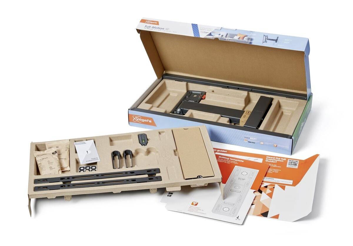Geöffnete Verpackung mit Teilen und Anleitungen für den Zusammenbau eines Gegenstands, enthält Metallschienen und Schrauben.