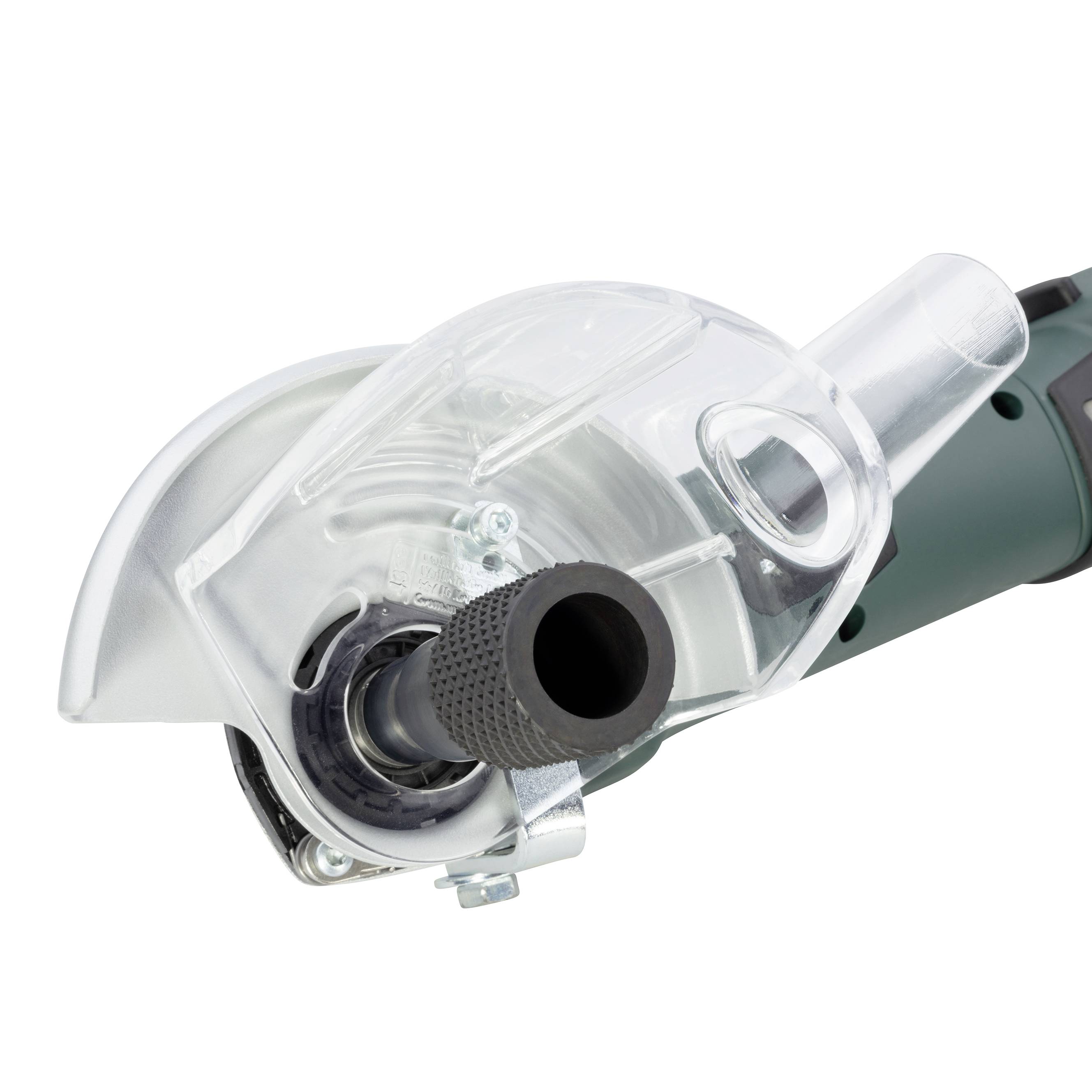 Eine Nahaufnahme eines Winkelschleifers mit einem Staubschutz und grünem Griff, verwendet zum Schneiden und Schleifen von Materialien.