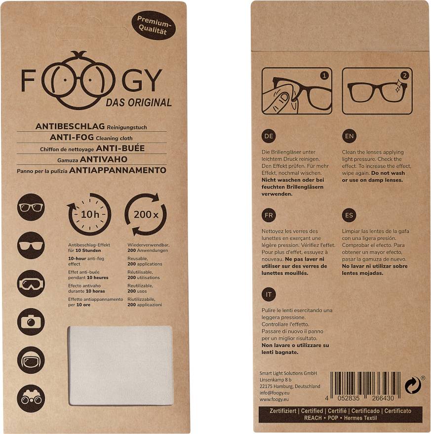 Antibeschlagtuch-Verpackung aus Karton. Marke 'Foggy Das Original'. Verspricht 10 Stunden wirksame Brillenreinigung. Enthält Zertifizierungen.