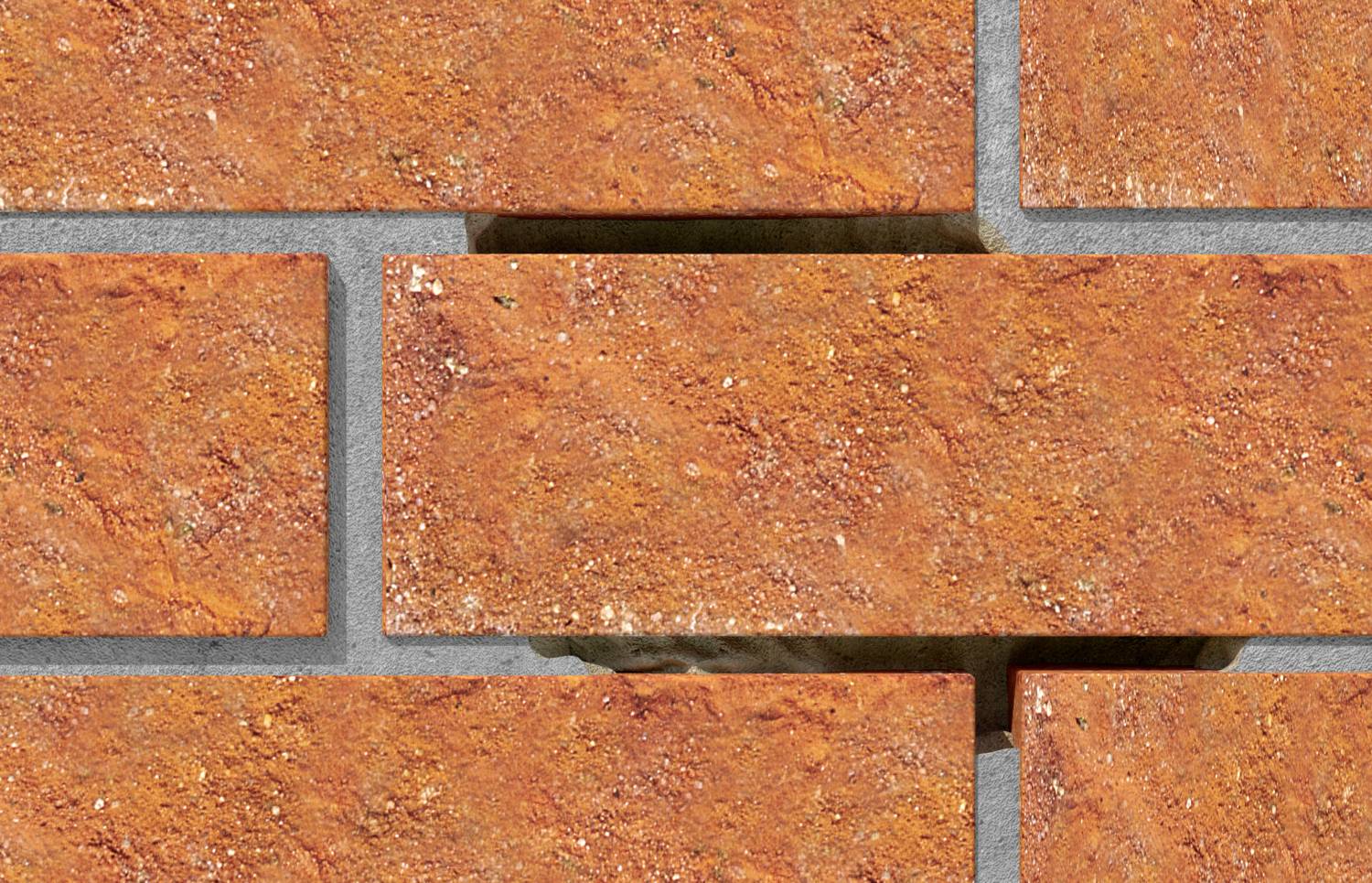 Nahaufnahme einer Ziegelwand mit fehlendem Ziegel in der Mitte, der den dahinterliegenden Zement und den Schatten sichtbar macht.