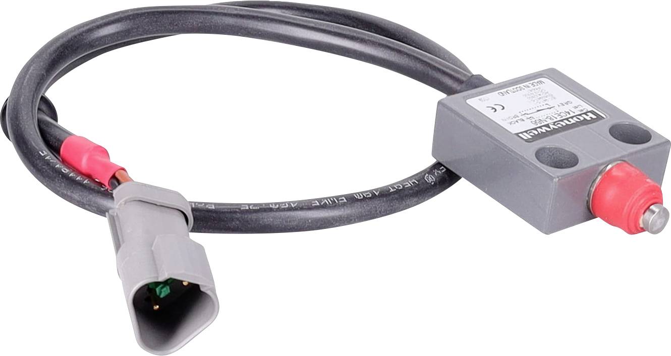 Ein aufgewickeltes schwarzes Kabel mit einer grauen rechteckigen Sensorbox und einem grauen Anschluss-Stecker, der grüne Innenpins zeigt.