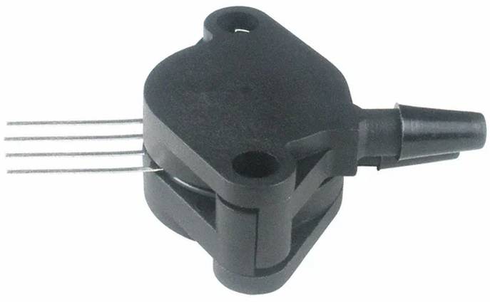 Ein Kurbelwellensensor mit schwarzem ovalem Gehäuse, Befestigungslöchern und seitlich angebrachten Steckerkontakten.