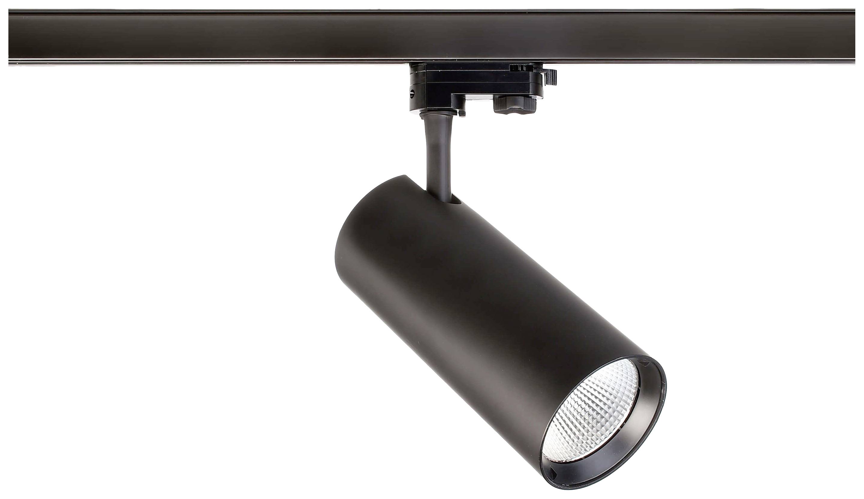 Ein schwarzer zylindrischer Deckenstrahler ist an einer Schiene montiert. Der Strahler ist nach unten gerichtet und leuchtet.