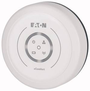 Ein weißer, runder xComfort-Smart-Home-Controller von EATON mit Symbolen für Power, Netzwerk, Wi-Fi und Batterie auf der Vorderseite.