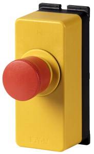 Ein roter Not-Aus-Schalter auf einem gelben Hintergrund mit schwarzem Rahmen, zur Sicherheit oder Abschalten von Maschinen.