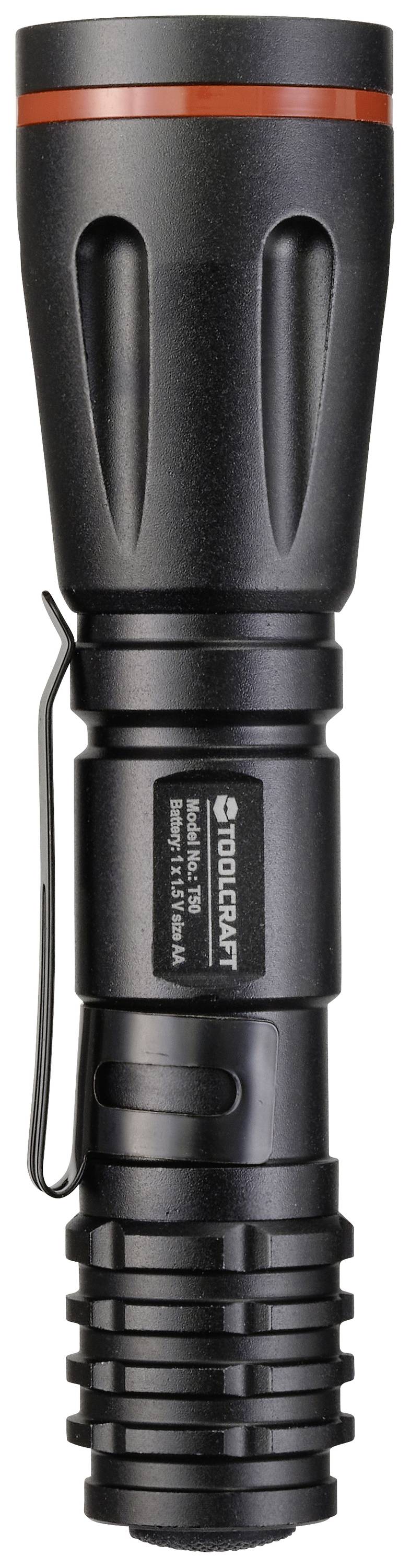 Taschenlampe in Schwarz mit rotem Ring, Seitenclip und Herstellerlogo. Abgerundete Oberfläche mit gerilltem Griffbereich.
