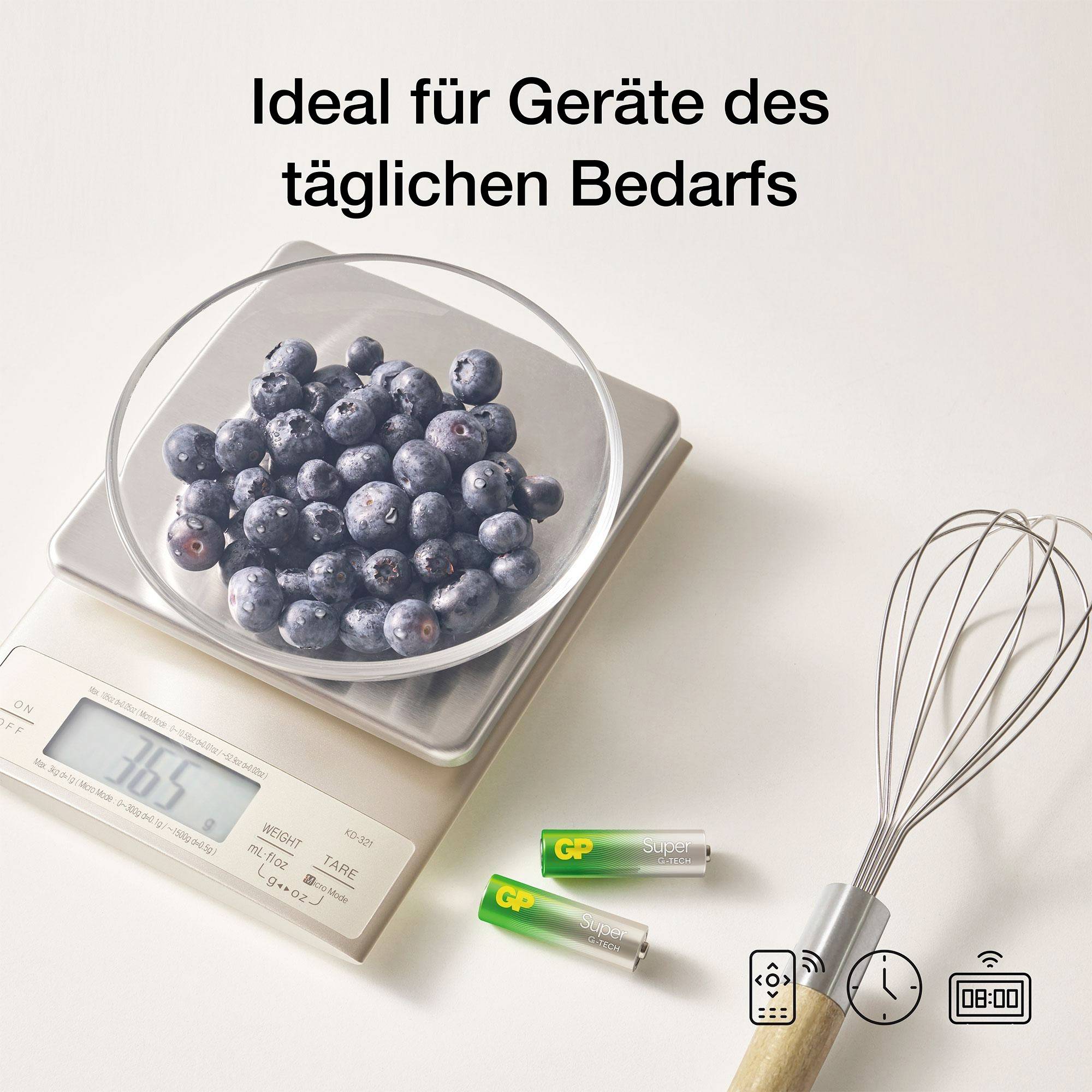 Digitalwaage mit Schüssel voller Blaubeeren; Text 'Ideal für Geräte des täglichen Bedarfs' sowie Batterien und Schneebesen daneben.