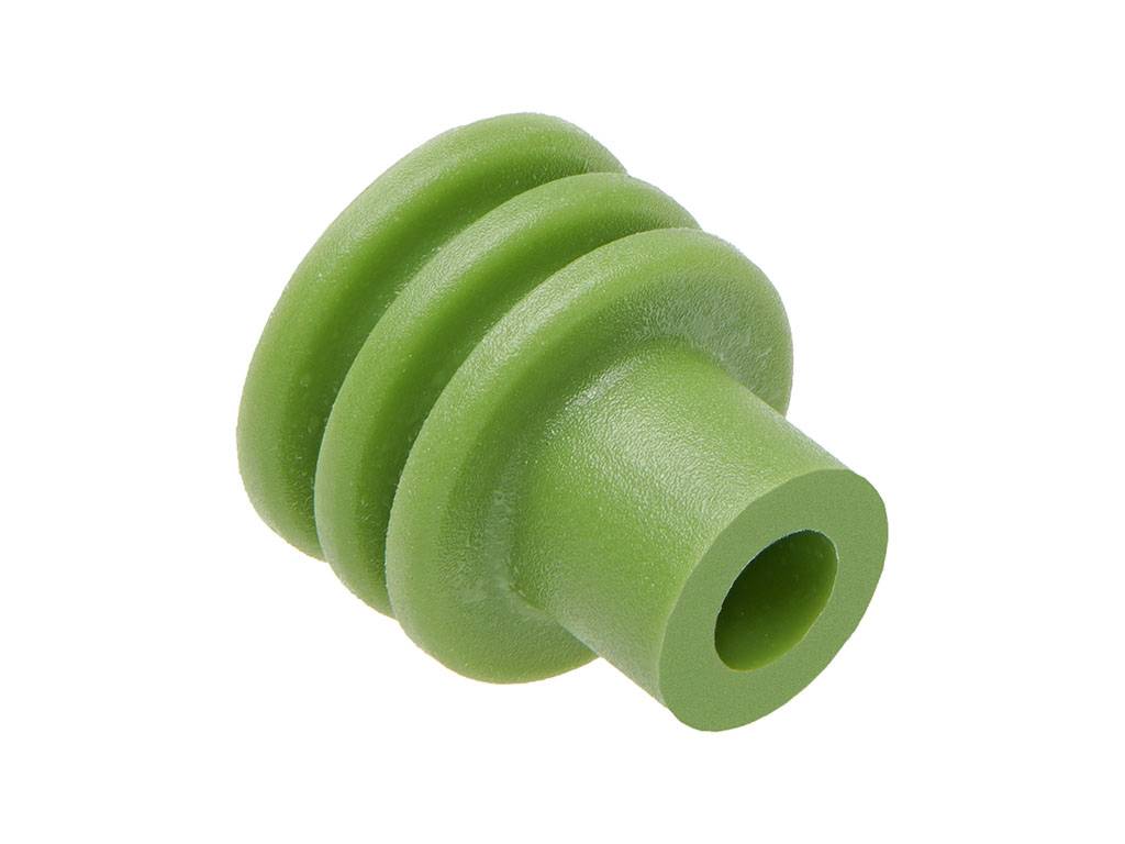 Ein grünes Gummiteil mit mehreren gestuften Ringen und einem Loch in der Mitte, möglicherweise ein Dichtungs- oder Verbindungsstück.