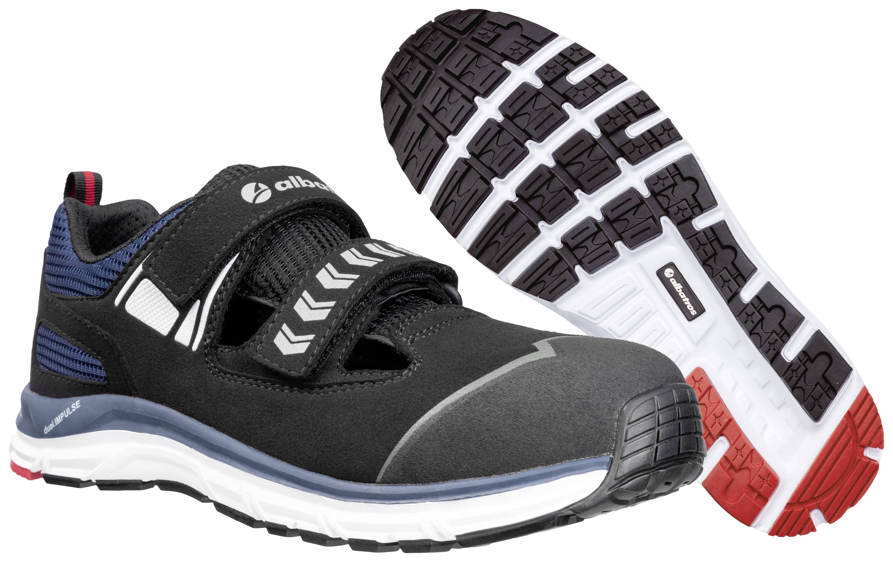 Ein Paar schwarze Halbschuhe mit Zehenschutz, markanten Sohlenprofil und Klettverschluss. Designt für Arbeitssicherheit und Komfort.