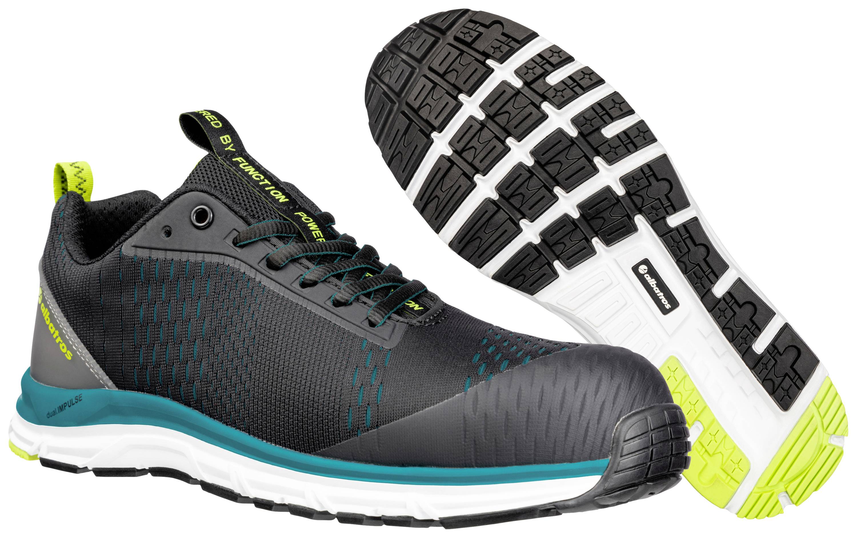 Schwarz-graue Sportschuhe mit grünen und blauen Akzenten, griffiger Sohle und Logo auf der Seite, vor weißem Hintergrund.