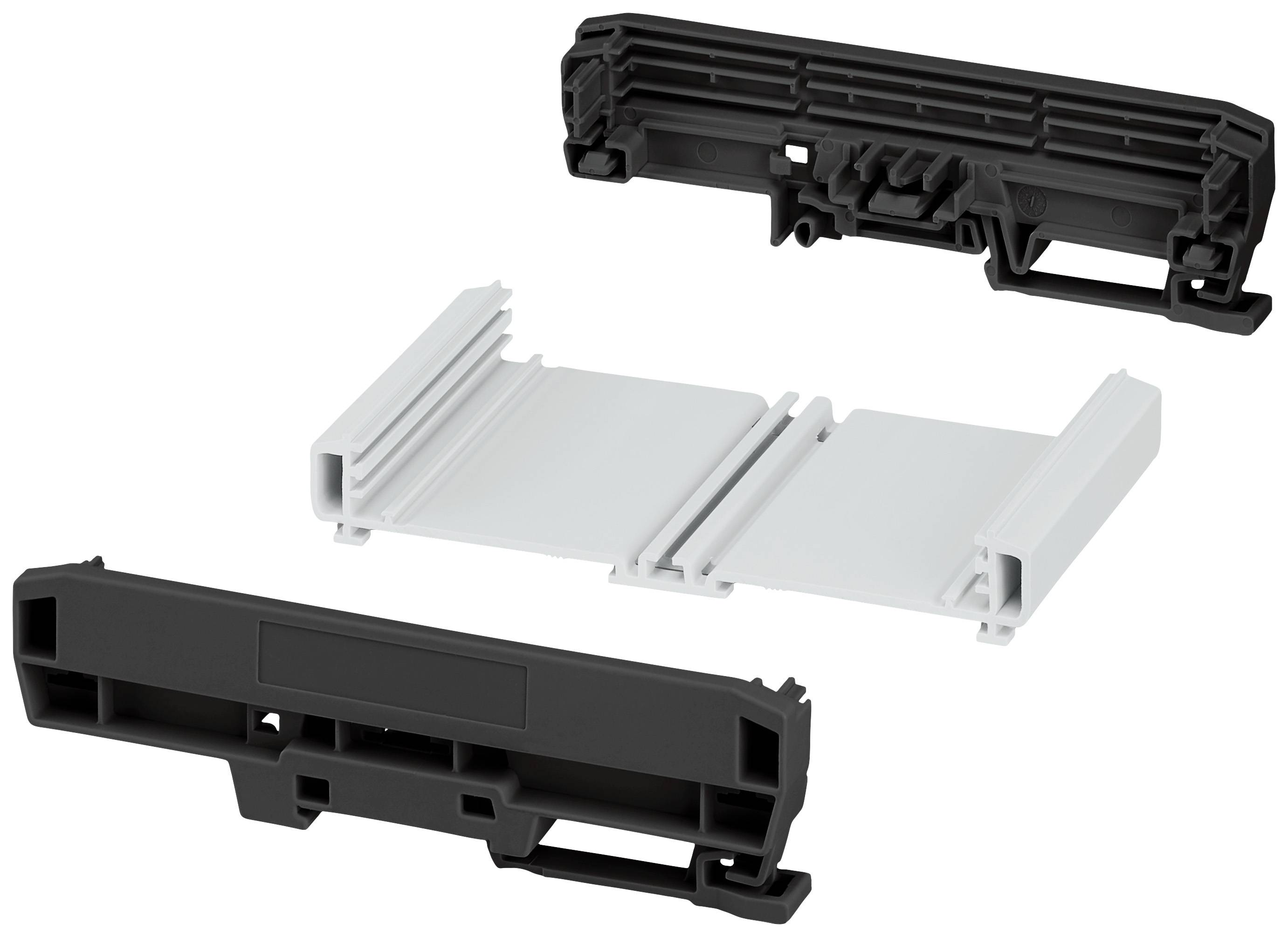 Drei verschiedene Kunststoffbauteile in einem kontrastierenden Schwarz-Weiß-Farbton, die in einer strukturierten Anordnung dargestellt sind.