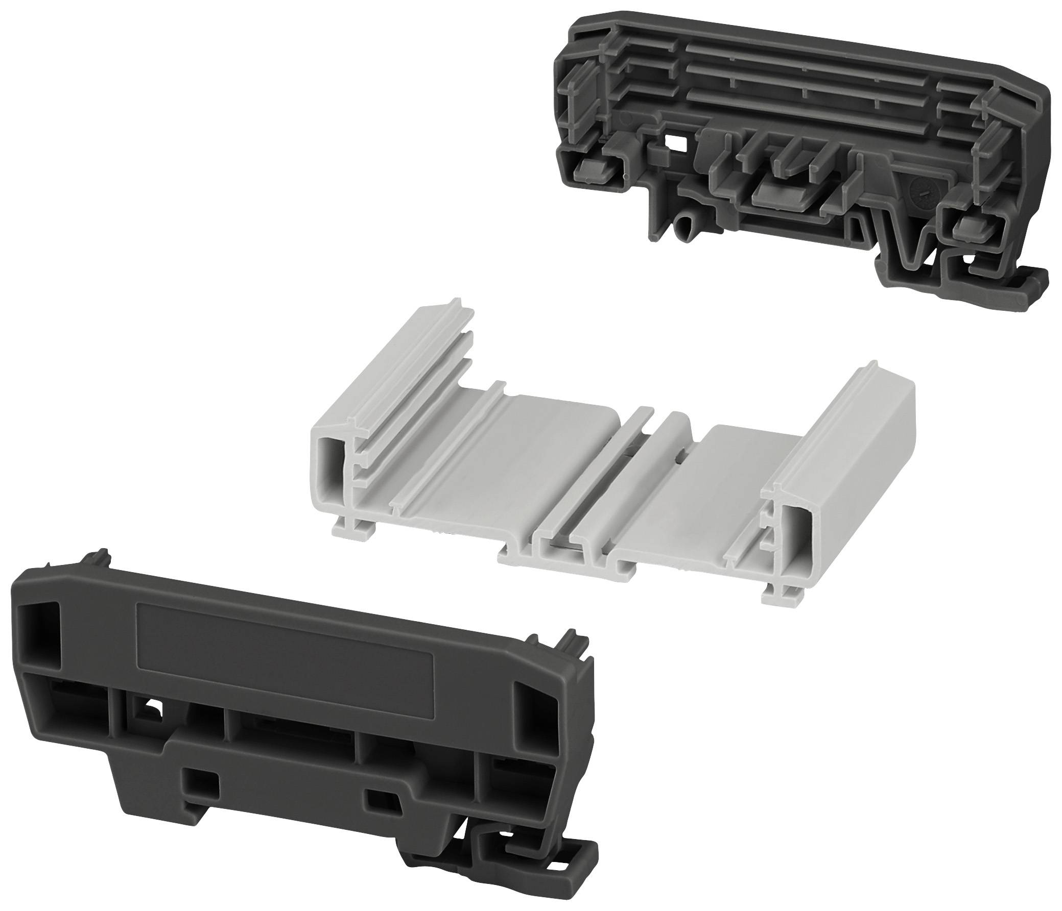 Drei Kunststoffteile in unterschiedlichen Formen und Farben, möglicherweise Bauteile eines Montagesystems. Zwei schwarze Teile, ein weißes.