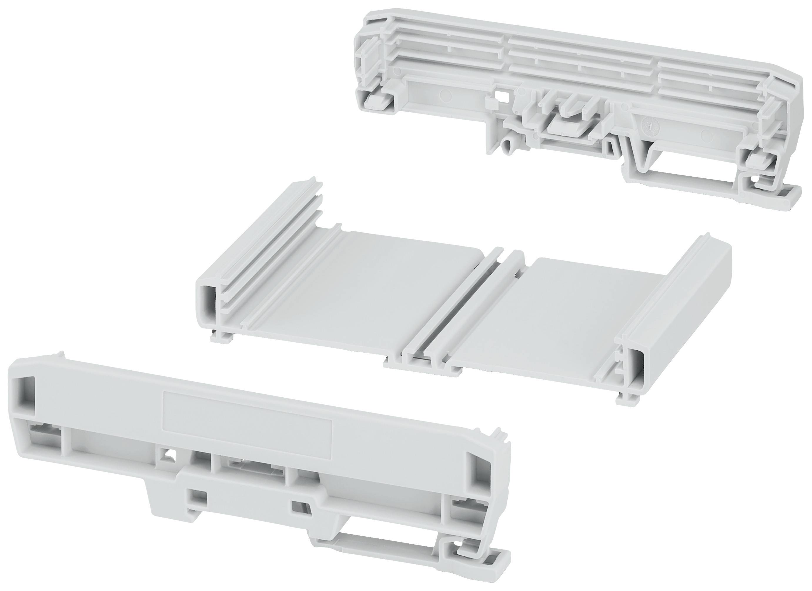 Dreiteiliges, hellgraues Kunststoffbauteil, modulare Struktur, unterschiedliche Formen und Größen für mechanische Anwendungen.