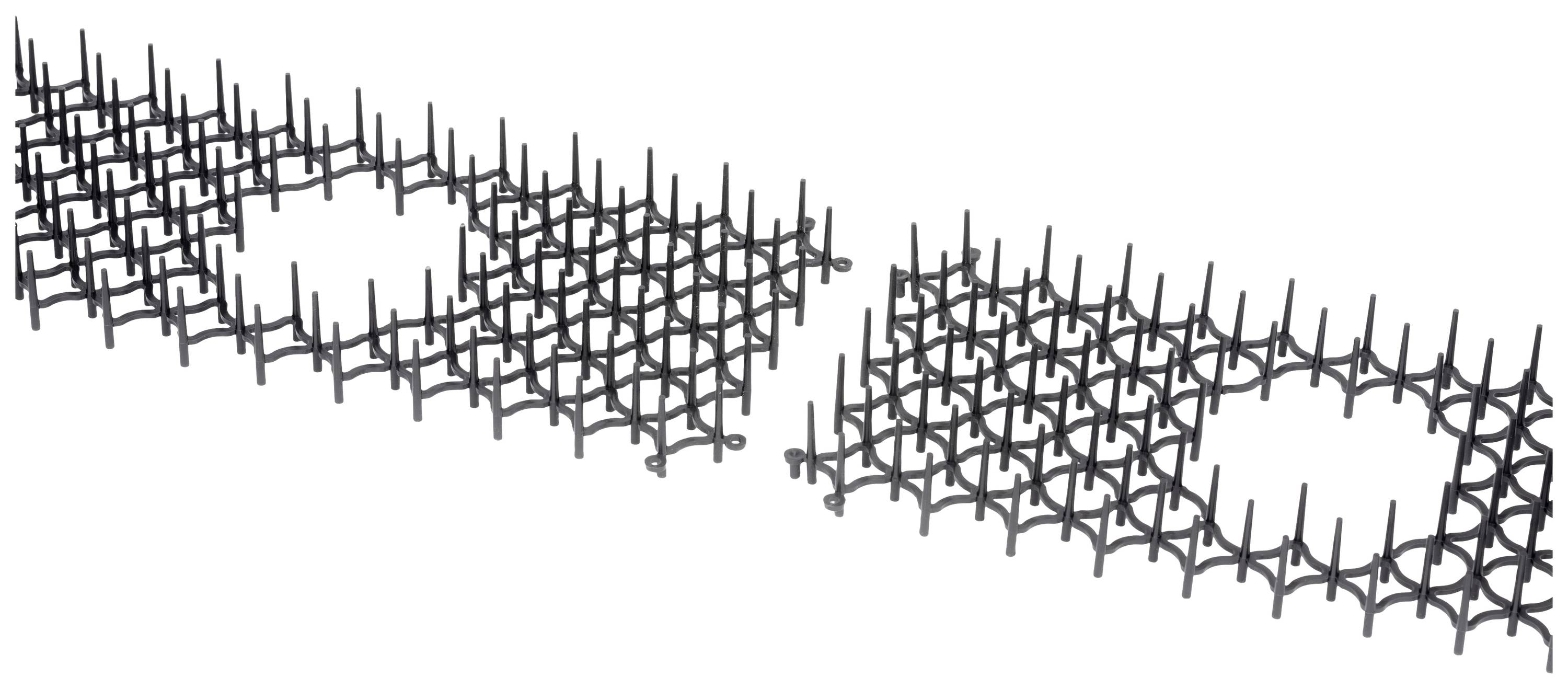 Zwei schwarze Gitterstrukturen nebeneinander, mit jeweils einem runden Loch in der Mitte.
