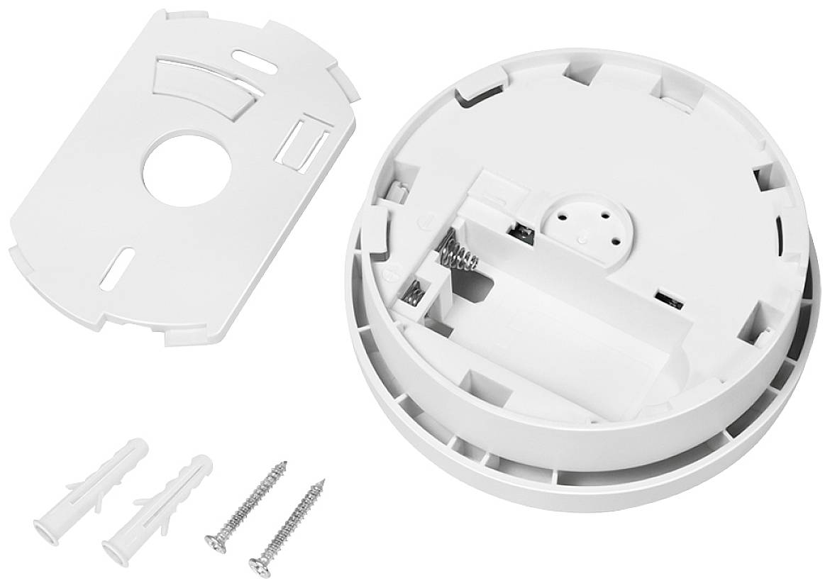 Rauchmelder mit abgenommenem weißen Gehäuse, zwei Schrauben und Dübel zur Wandmontage sichtbar im Bild.