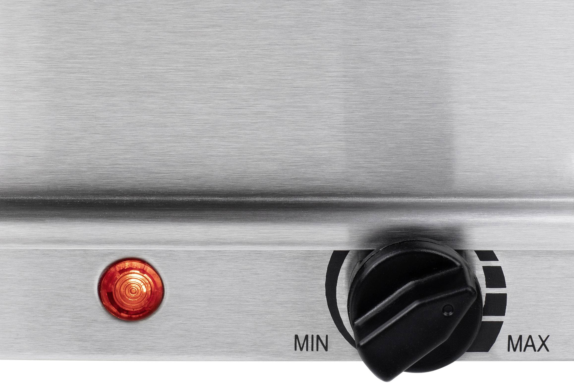 Metallene Oberfläche mit einem roten Licht und einem schwarzen Drehknopf. Der Knopf zeigt eine Skala von 'MIN' bis 'MAX'.