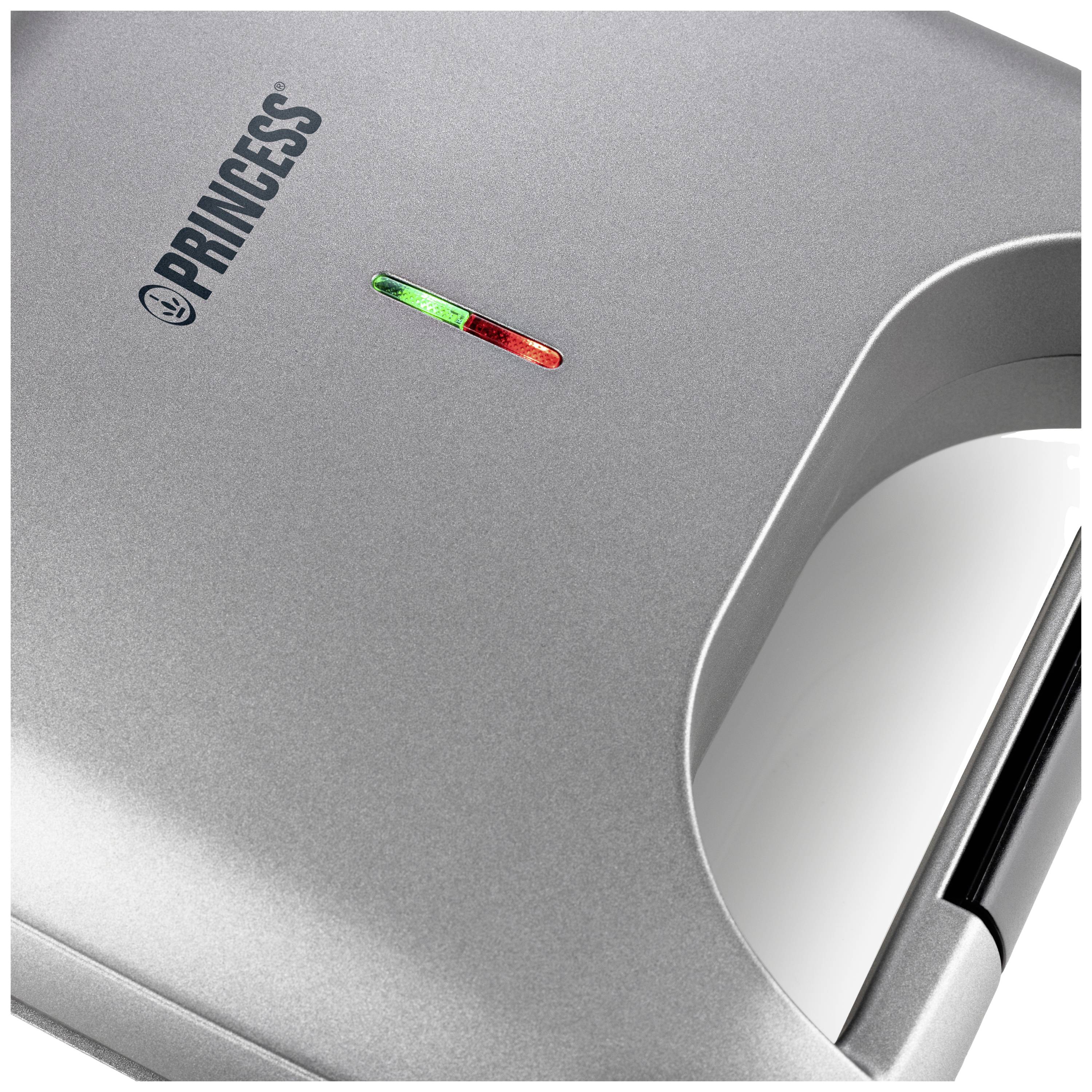 Waffeleisen von oben mit leuchtendem roten und grünem Licht auf dem Gerätedeckel, Marke 'PRINCESS'.
