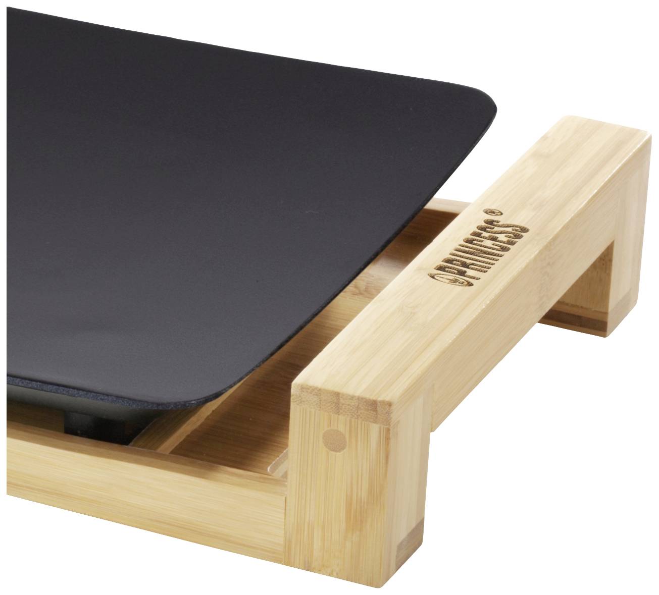 Holzrahmen mit eingepasstem, schwarzen Glätteisen auf einem Tisch.