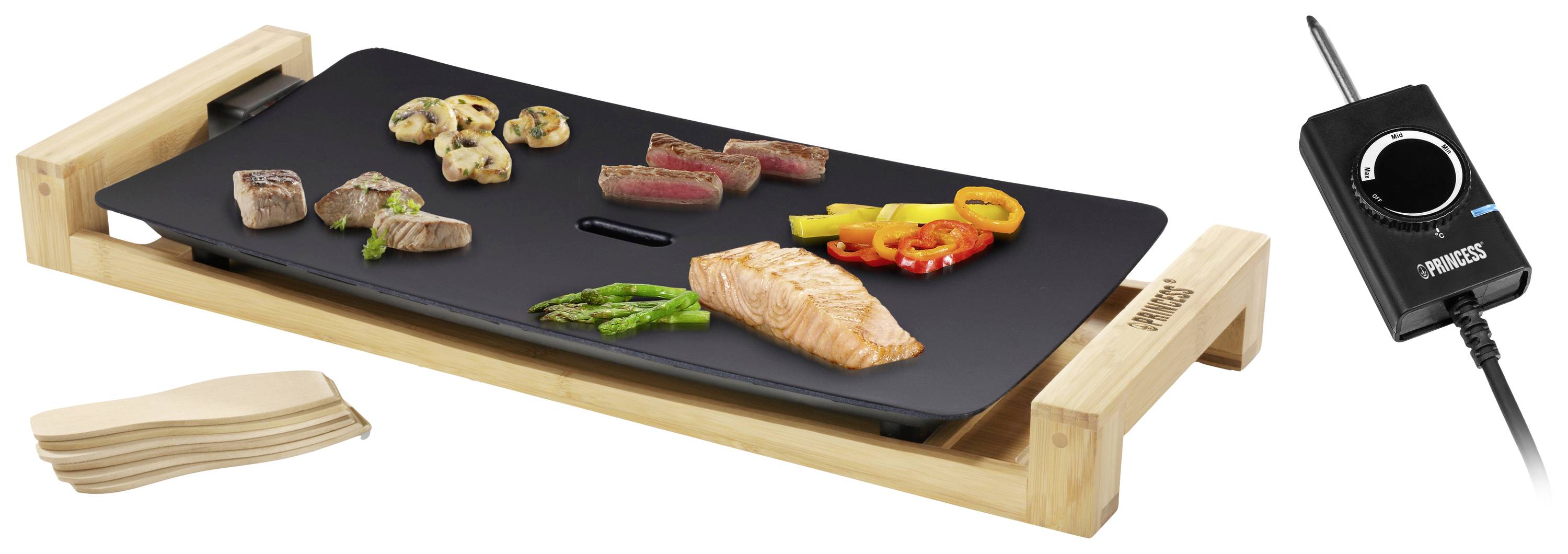 Elektrische Tischgrillplatte aus Holz mit verschiedenen Speisen wie Lachs, Fleisch und Gemüse. Rechts ein Temperaturregler.