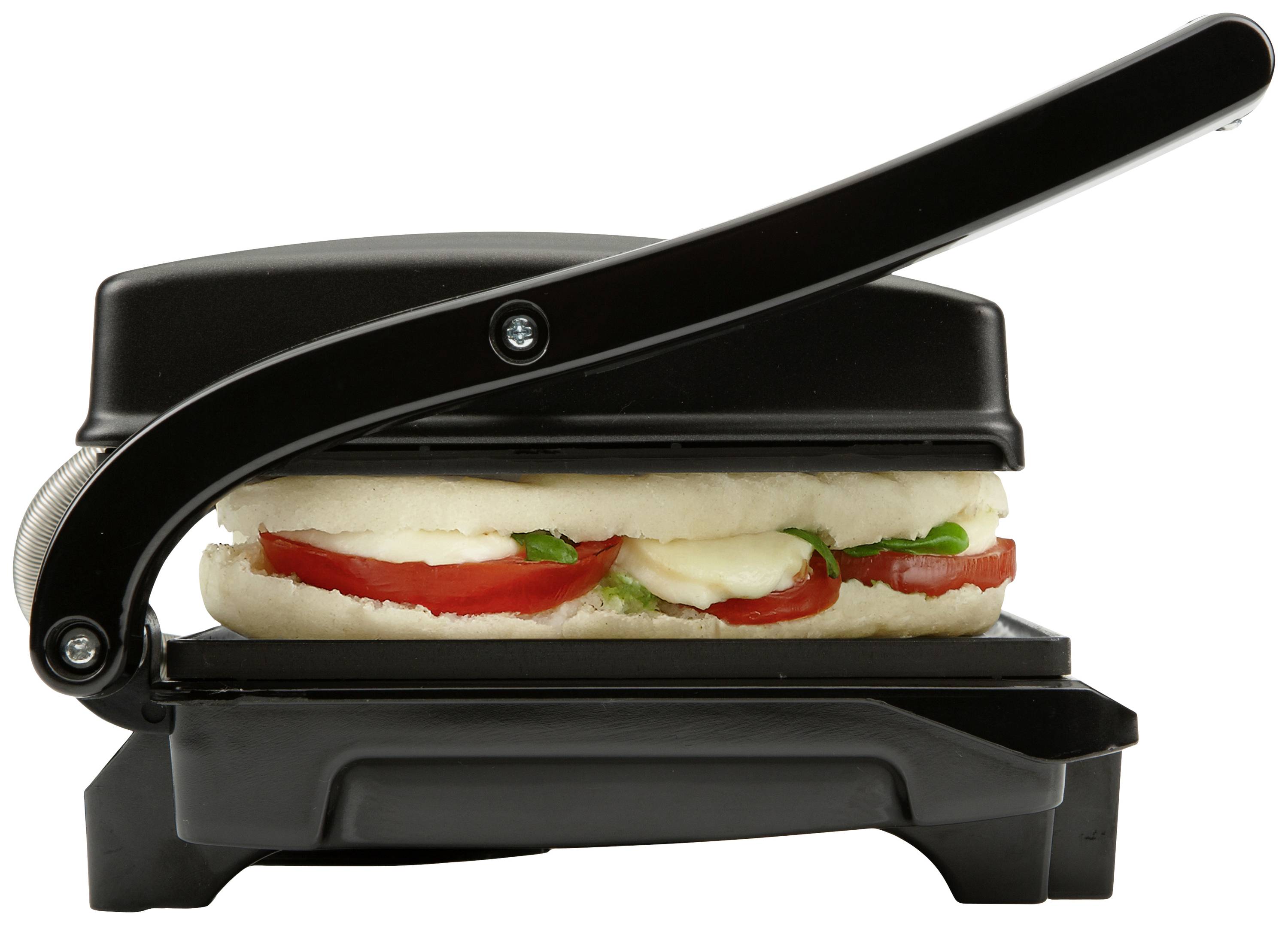 Ein Panini-Sandwich wird in einem schwarzen Panini-Grill zubereitet. Das Sandwich enthält Tomaten, Mozzarella und Basilikum.