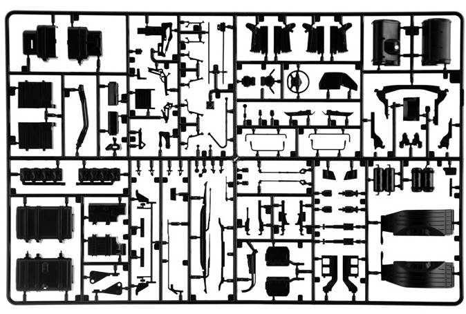 Ein Modellbausatz mit verschiedenen Kunststoffteilen, die präzise angeordnet sind, um ein Fahrzeug oder Modell zusammenzubauen.