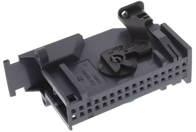 Eine schwarze kunststoffbasierte elektronische Komponente mit einer gitterartigen Oberfläche und einem Verriegelungsmechanismus, die für elektrische Verbindungen oder Geräte verwendet wird.