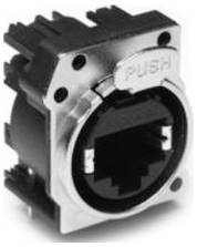 Ein Metallstecker mit einem rechteckigen Anschluss und der Aufschrift „PUSH