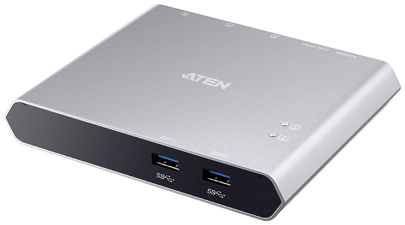 Ein silbernes, rechteckiges Gerät mit zwei USB-Anschlüssen an der Vorderseite und mehreren Anschlüssen oben, wahrscheinlich ein Hub oder Switch.