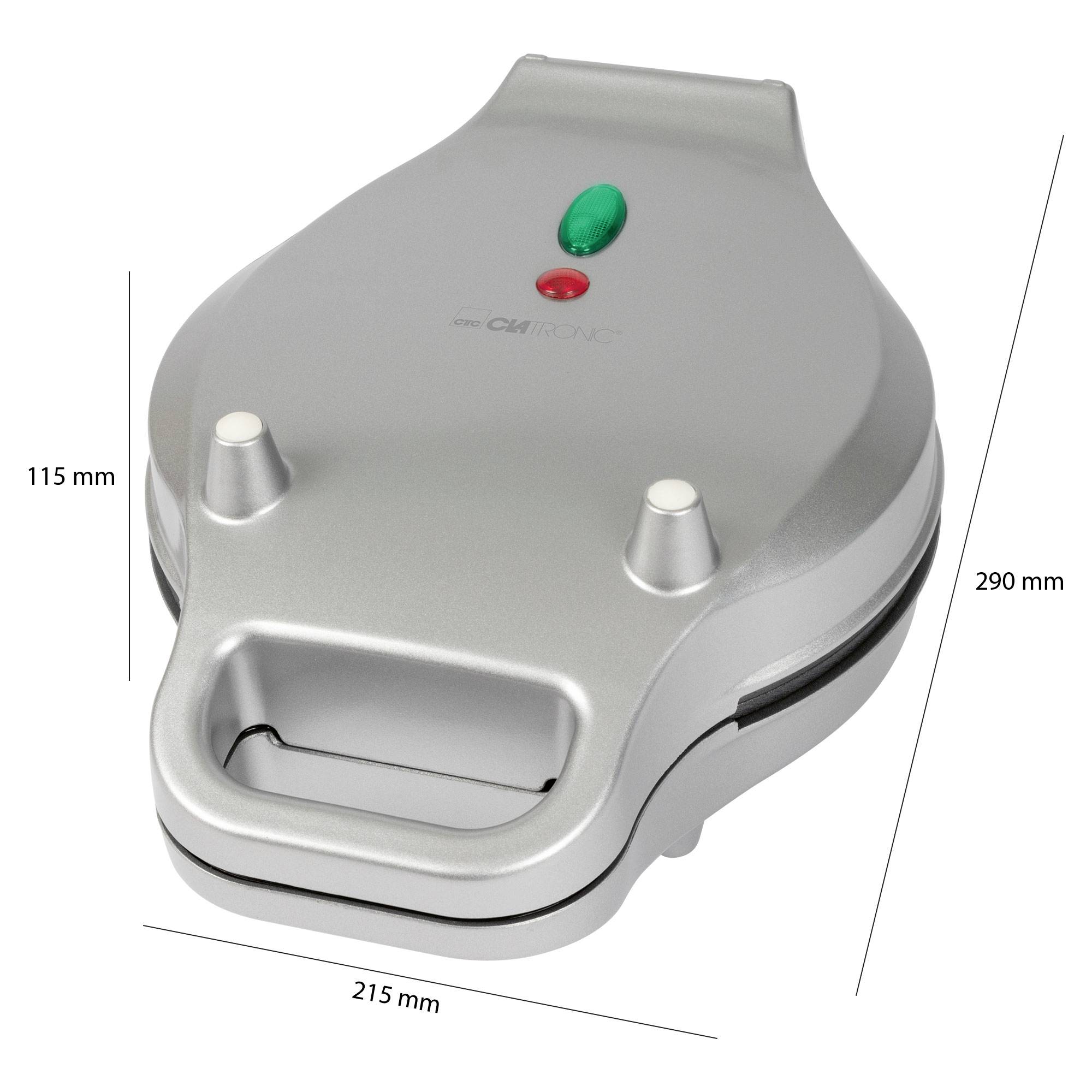 Silberner Waffeleisen mit Kontrollleuchten, geschlossen. Maße: 290 mm lang, 215 mm breit, 115 mm hoch.