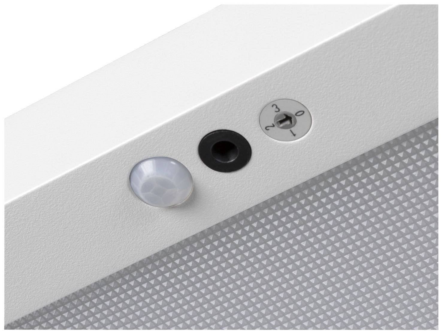 Ein Bewegungssensor, ein schwarzes Loch und ein Schalter mit den Einstellungen 0, 2, und 3 auf einem weißen Gerätengehäuse.