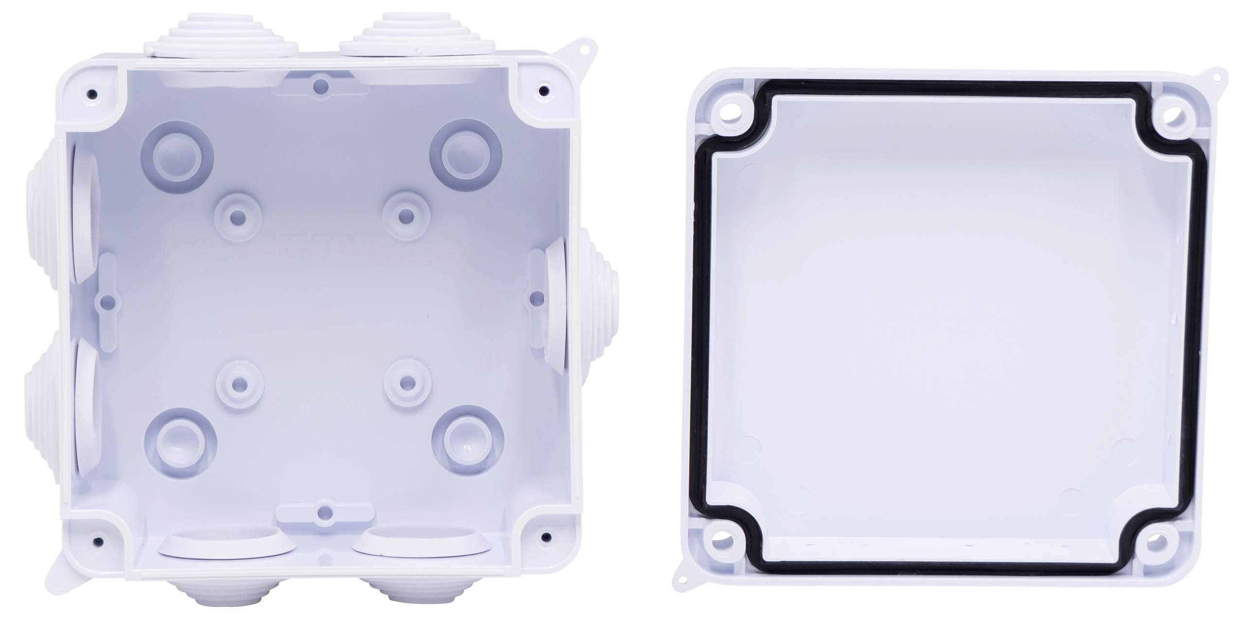 Eine weiße elektrische Anschlussdose aus Kunststoff, geöffnet mit separatem Deckel. Sichtbare Schraublöcher und Kabeleinführungen.