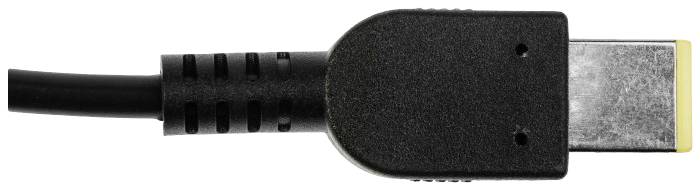 Ein schwarzes, rechteckiges Kabelende mit gelbem Stecker.