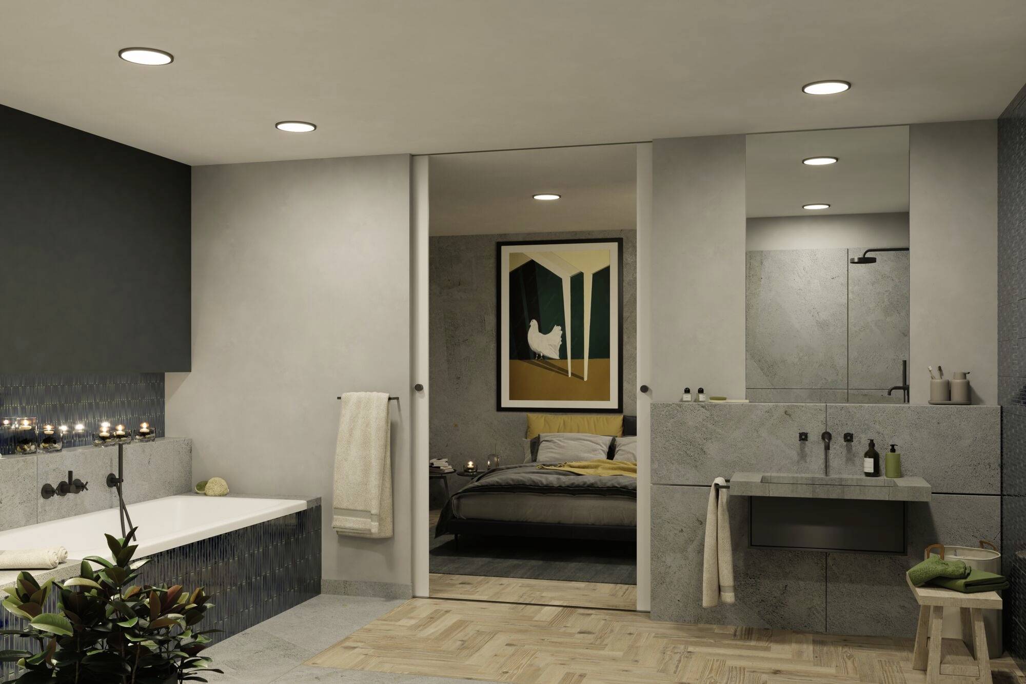 Modernes Badezimmer mit Wanne und Waschbecken aus Stein, öffnet sich zu einem Schlafzimmer mit Kunst an der Wand. Warme Beleuchtung.